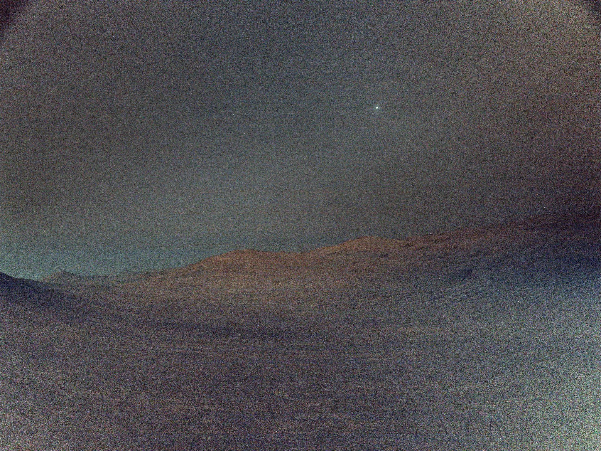 NASA’s Perseverance rover captures a rare pre-dawn view of Mars’ moon Deimos glowing in the dark Martian sky before sunrise